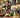 DALL·E_2024-08-08_07.28.00_-_A_realistic_image_of_an_Indian_person_in_the_kitchen,_cooking_food_for_their_dog_using_chicken_and_vegetables._The_person_is_smiling_as_they_prepare_t (1